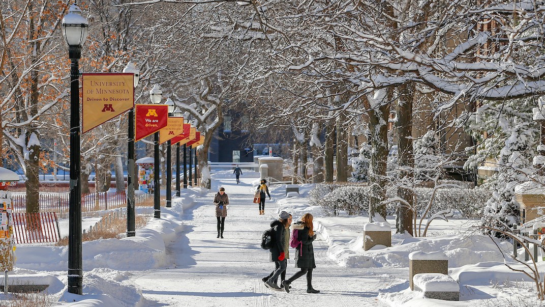 A photo of campus in the winter, with snow covering the sidewalks.