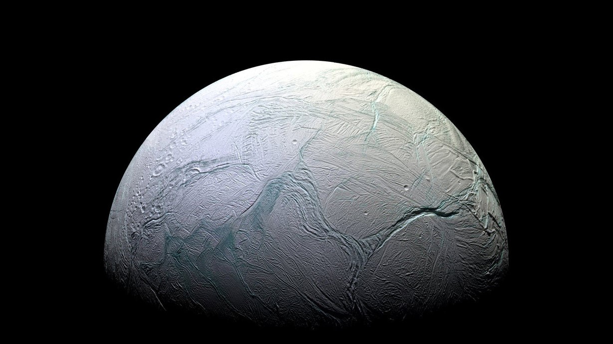 A view of Saturn’s moon Enceladus taken by NASA’s Cassini spacecraft; photo by NASA/JPL-Caltech