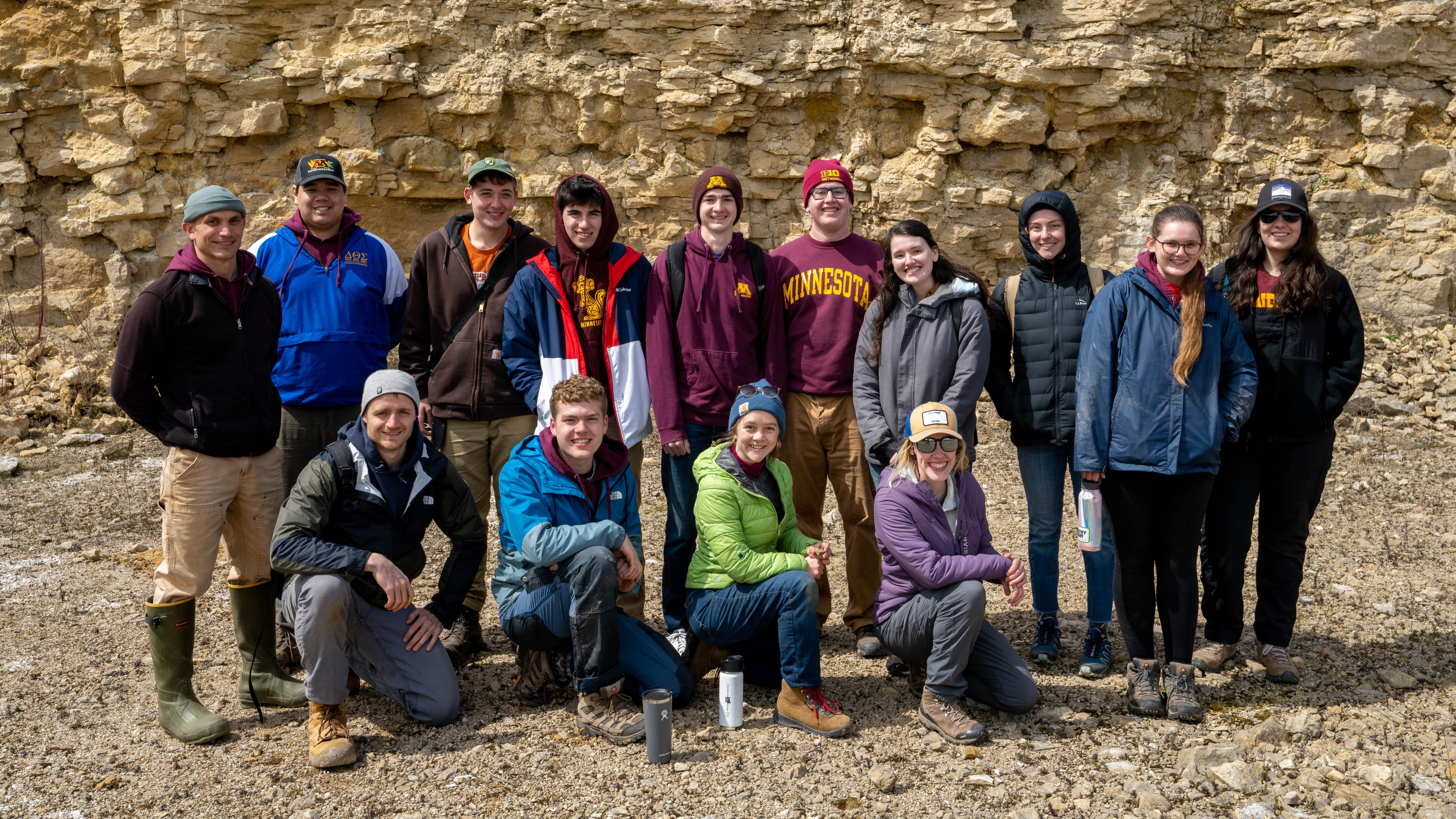 The 2022 UMN soil judging team standing in front of a sandstone bluff