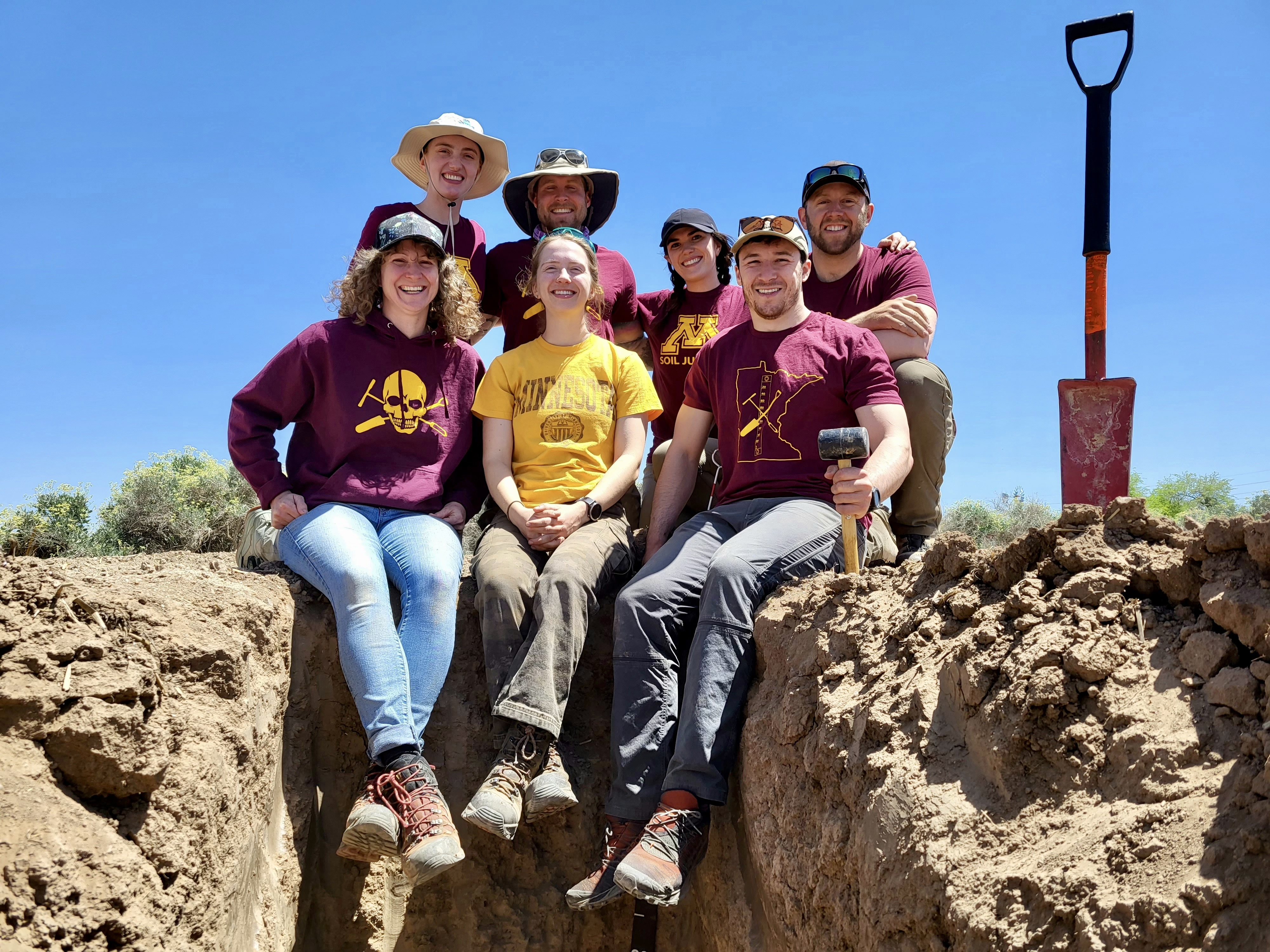 A photo of seven soil science alumni at a training in Arizona.