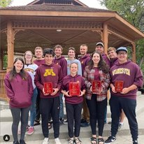 A group photo of the UMN Soil Judging team wearing school colors and holding their award plaques