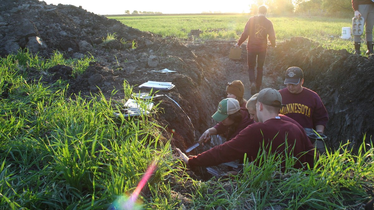 A photo of the UMN Soil Judging team in a soil pit; photo by Aimee Gillespie 