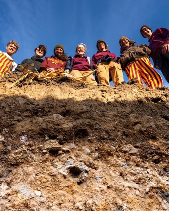 A photo of the UMN soil judging team looking into a soil pit; photo by Irfan Ainuddin