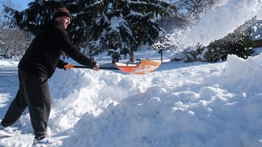 A photo of a man shoveling snow; by Tim Evans for MPR.