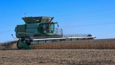 A photo of a large machine harvesting crops; photo by Emily Urfer