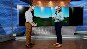 A photo of Heidi Roop and a broadcaster wearing virtual reality headsets 