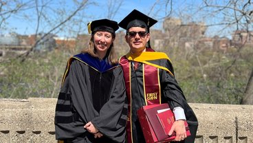 A photo of Melissa Wilson and Luis Allen wearing graduation caps and gowns 